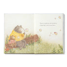 Open spread of the bears blowing bubbles beside a fallen log