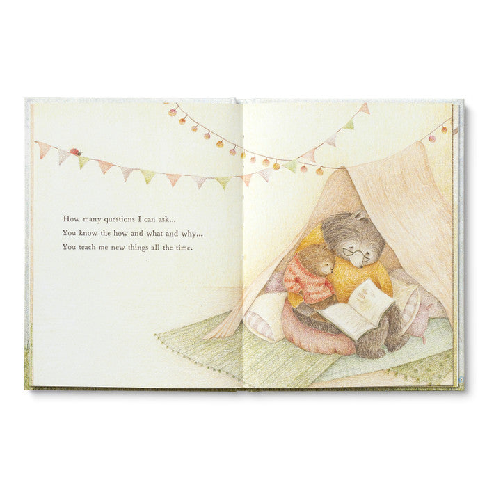 Open spread of the bears reading inside a blanket fort strung with bunting