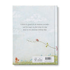 Back cover in pale blue with a kite and a closing verse about ordinary days