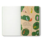 Open journal with a leafy breakout page of small birds and a Rachel Naomi Remen quote on compassion