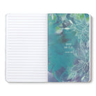 Open journal with lined pages beside a teal breakout page of line-drawn leaves and a short quote