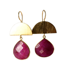 Brushed gold half-moon earrings with large faceted raspberry-pink ruby drops
