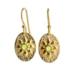 Textured gold oval drop earrings with a flower motif and a lime-green peridot centre
