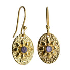 Textured gold oval drop earrings with a flower motif and a violet amethyst centre