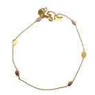 Fine gold chain necklace with pink and taupe opal stones and brushed gold ovals, laid in a circle