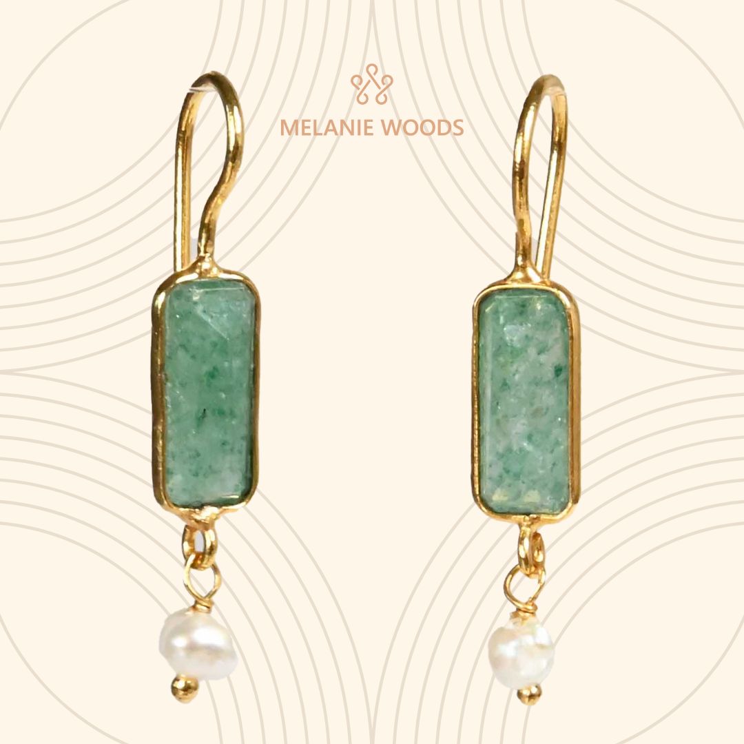 Euro Gold earrings with green chalcedony bars and pearl drops, on patterned cream backdrop