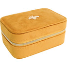 Closed mustard velvet jewellery case with gold zip and jewelled bee embellishment on top