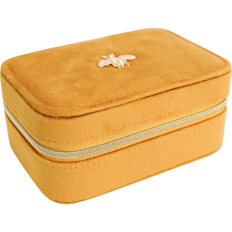 Closed mustard velvet jewellery case with gold zip and jewelled bee embellishment on top