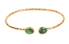 Euro Gold cuff bangle with two emerald-green gems on black background