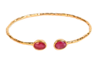 Euro Gold cuff bangle with two ruby-red gems on black background