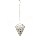 Chalky white metal heart embossed with a soft floral pattern, hanging from a long chain with a hook at the top.