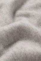 Texture close-up of the Quartz Pink pale grey merino