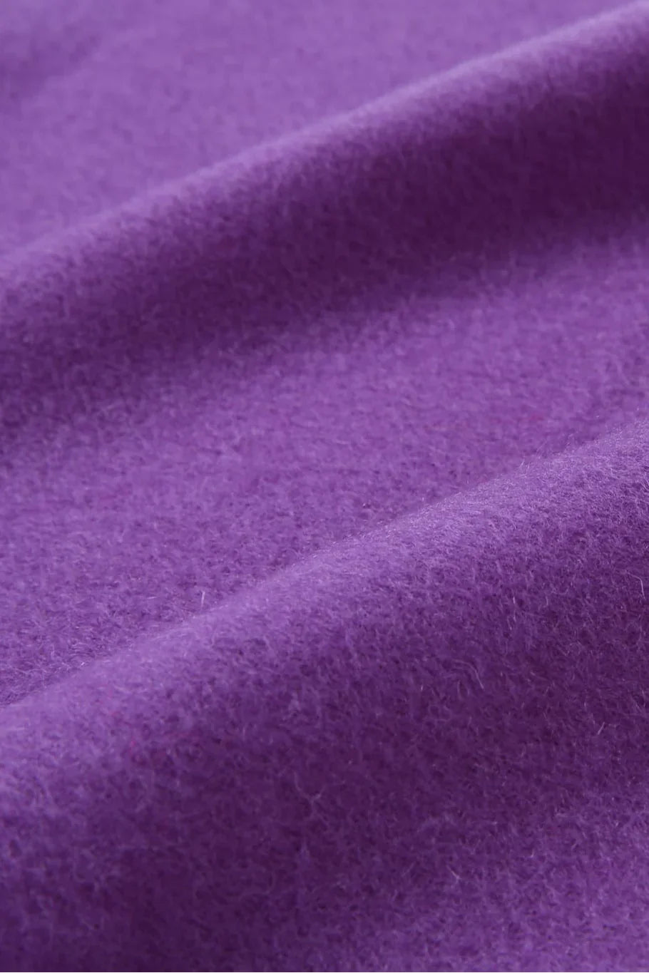Texture close-up of the Iris violet merino weave