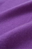 Texture close-up of the Iris violet merino weave