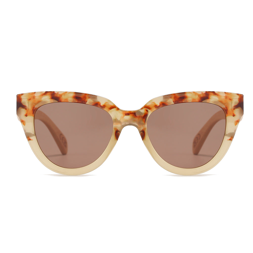 Flutter sunglasses front-on: a cat-eye frame, tortoise across the brow fading to cream below