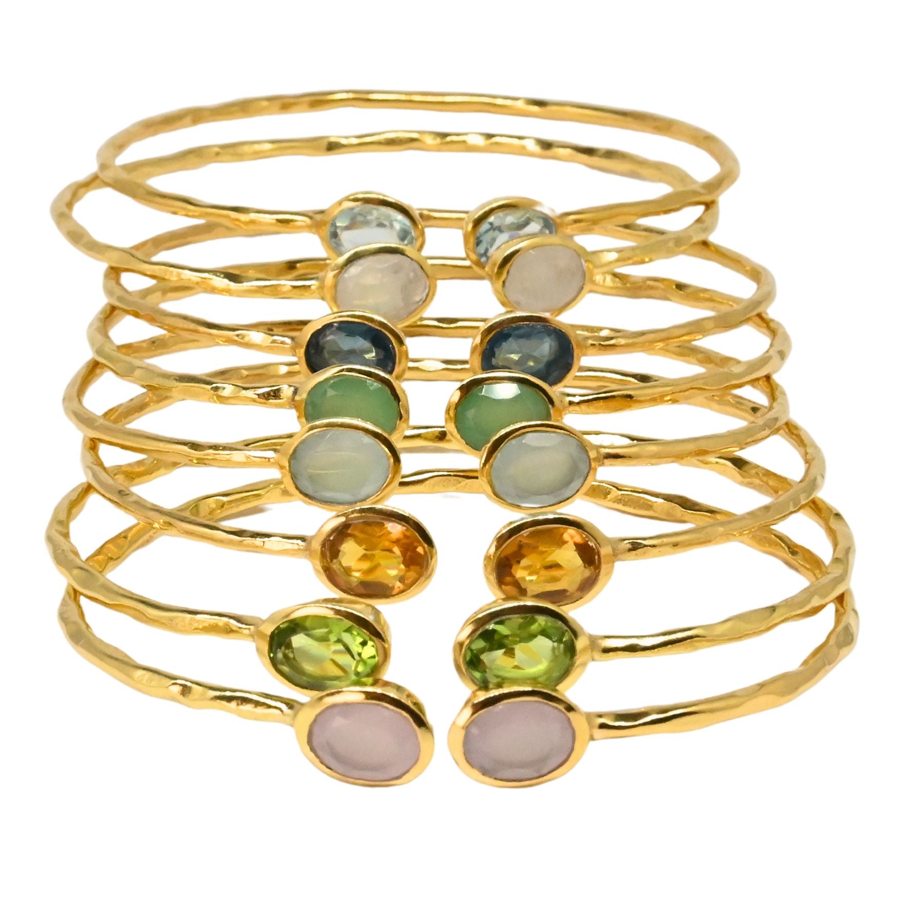 Stack of hammered Euro Gold cuff bangles with assorted oval gemstones