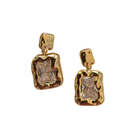 Pair of drop earrings with clear rectangular crystals set in hammered gold-tone frames.