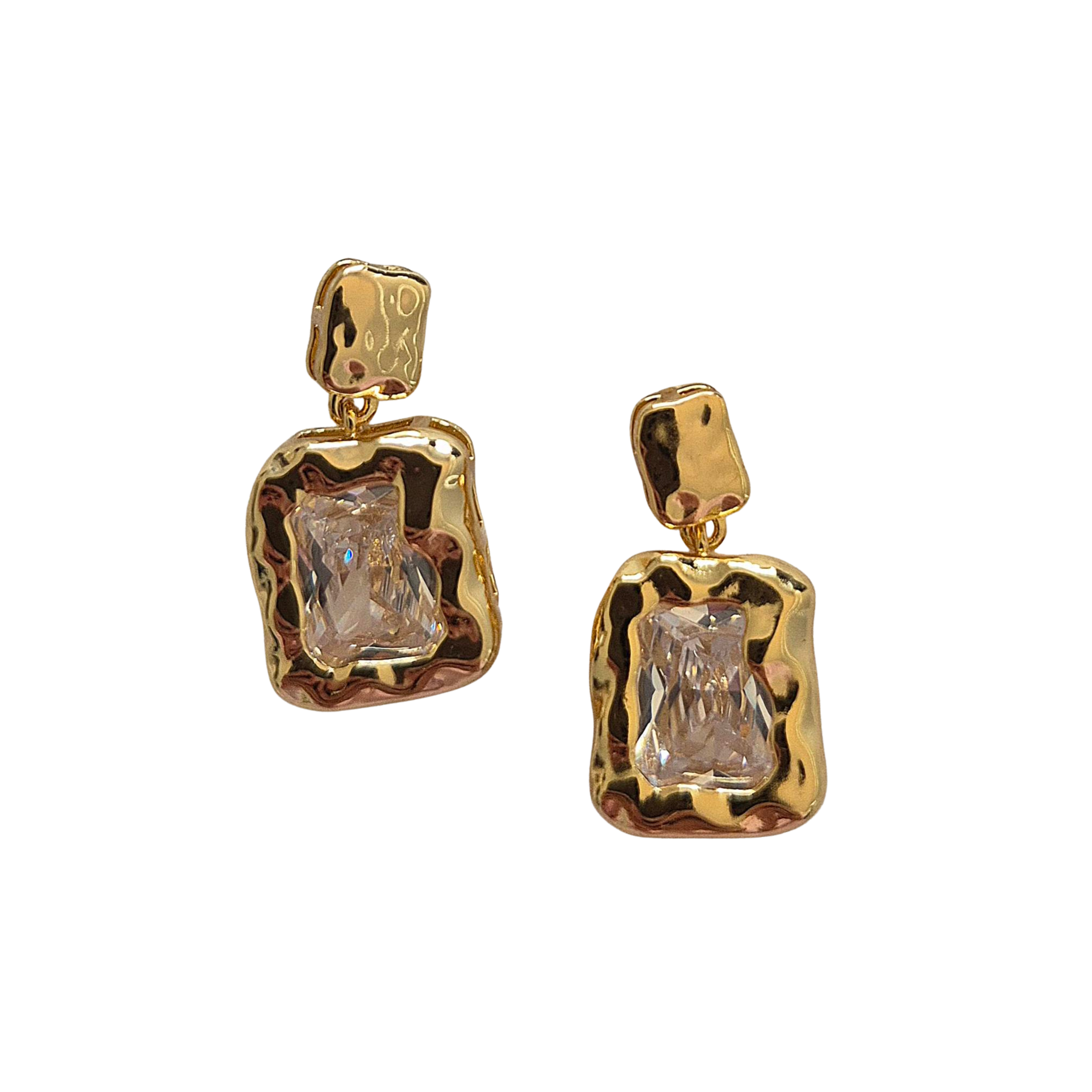 Pair of drop earrings with clear rectangular crystals set in hammered gold-tone frames.