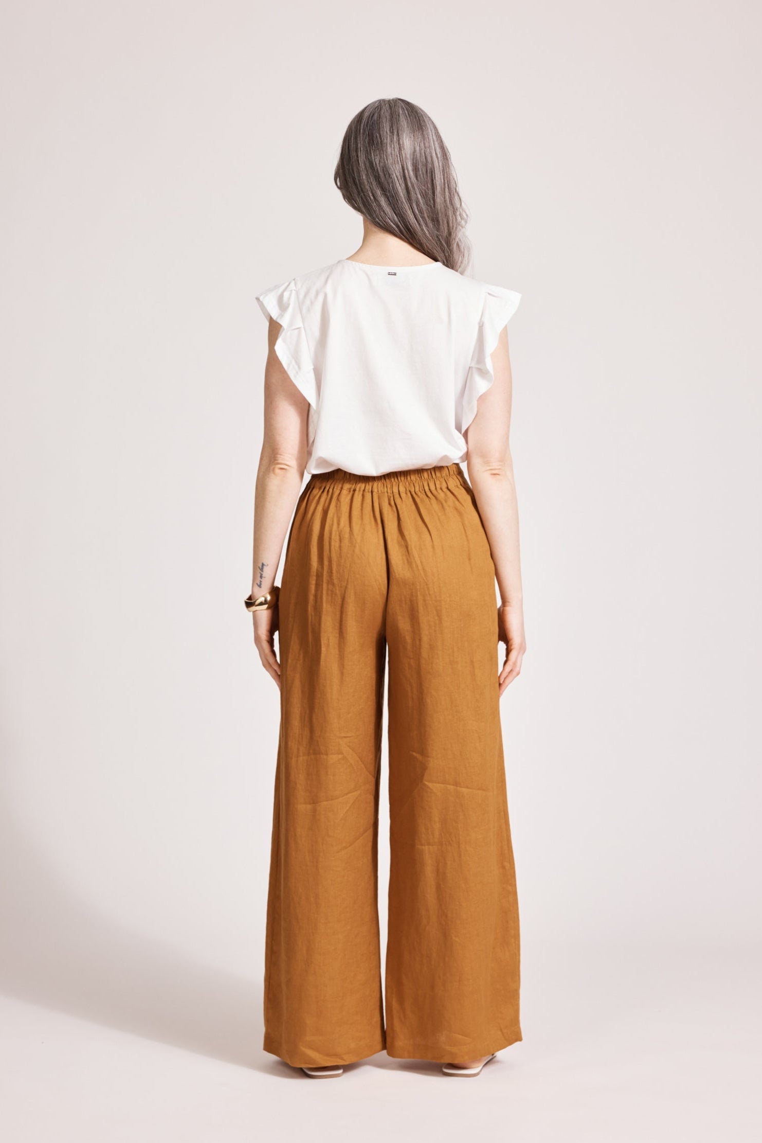 Back view showing the elasticated waist of the caramel pant