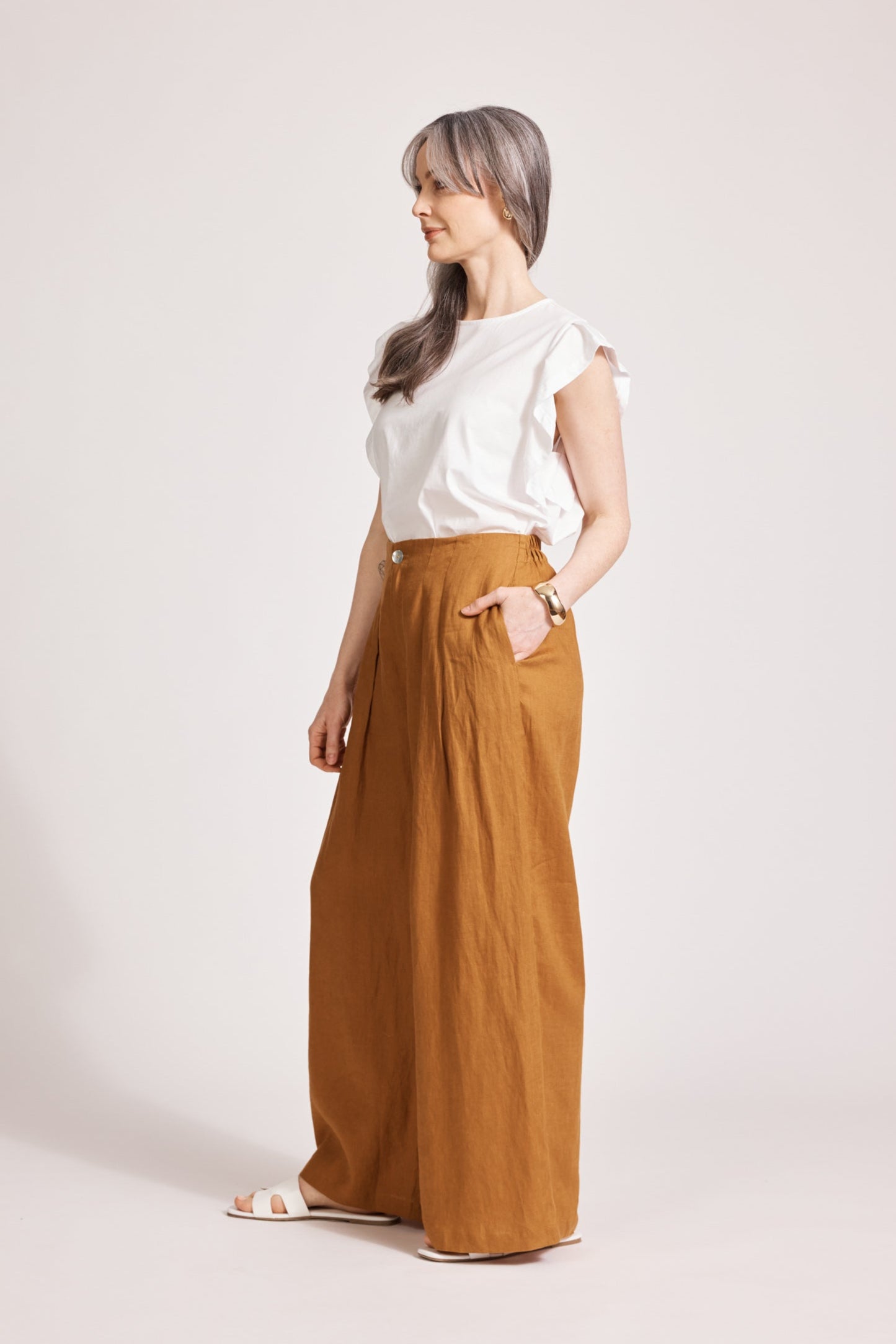 Side view of the flowing caramel Miramar Palazzo Pant