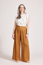 Model in the caramel linen Miramar Palazzo Pant with a white frill top