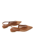 Side view of the flat-soled Alcazar slingback sandals