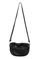 Black Zala Bag hanging by its long crossbody strap