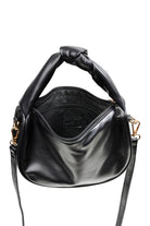 Front view of the black Zala Bag with strap attached