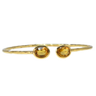 Euro Gold cuff bangle with two citrine gems angled on white