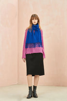 Full-length pink jumper and black skirt look with the Veronica Blue scarf