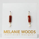 Euro Gold earrings with rich red carnelian bars and freshwater pearl drops, on Melanie Woods designer card