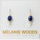Euro Gold earrings with oval lapis-blue gems and tiny pearl drops on a Melanie Woods presentation card