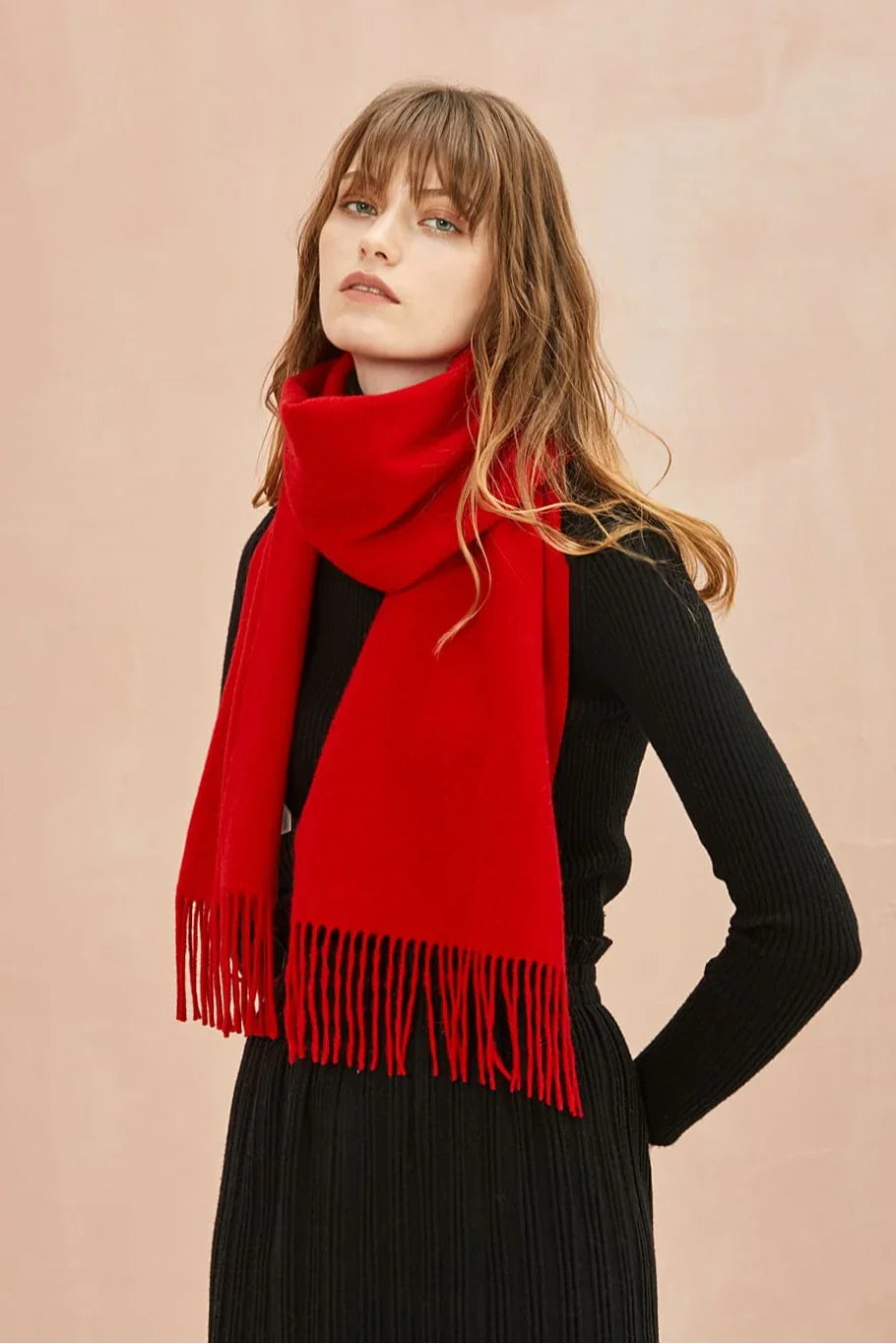 Side pose with the Raving Red merino scarf and fringed ends