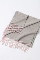 Quartz Pink scarf folded flat showing its two-tone fringe