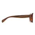 Side profile of the Stray Coffee Bean sunglasses showing the striped walnut arm engraved with Soek