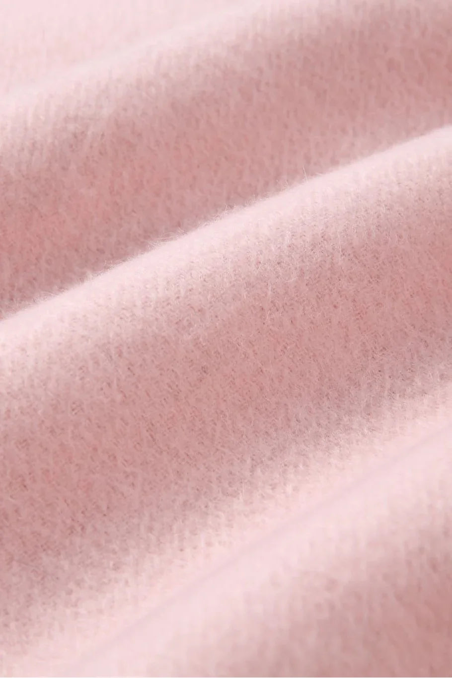 Texture close-up of the Dahlia soft pink merino