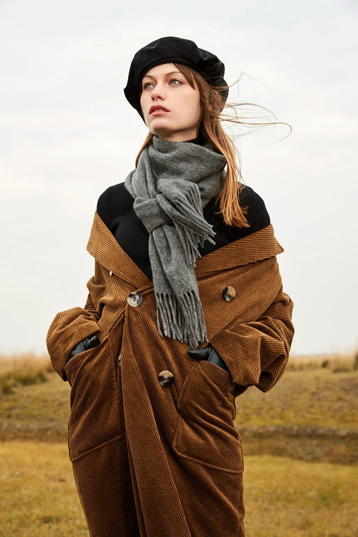 Windswept outdoor portrait with the Light Charcoal grey scarf