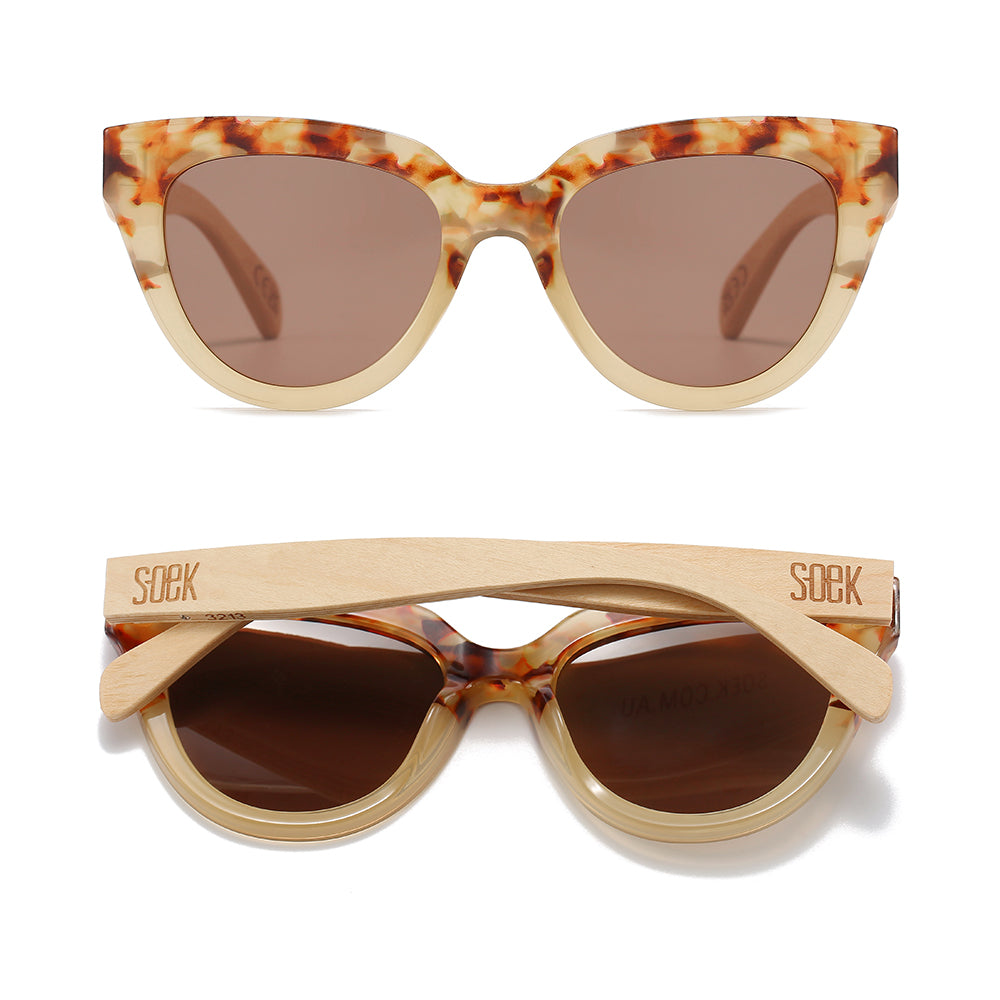 Two pairs of Flutter sunglasses in desert tortoise, one front-on and one folded, showing the pale maple arms