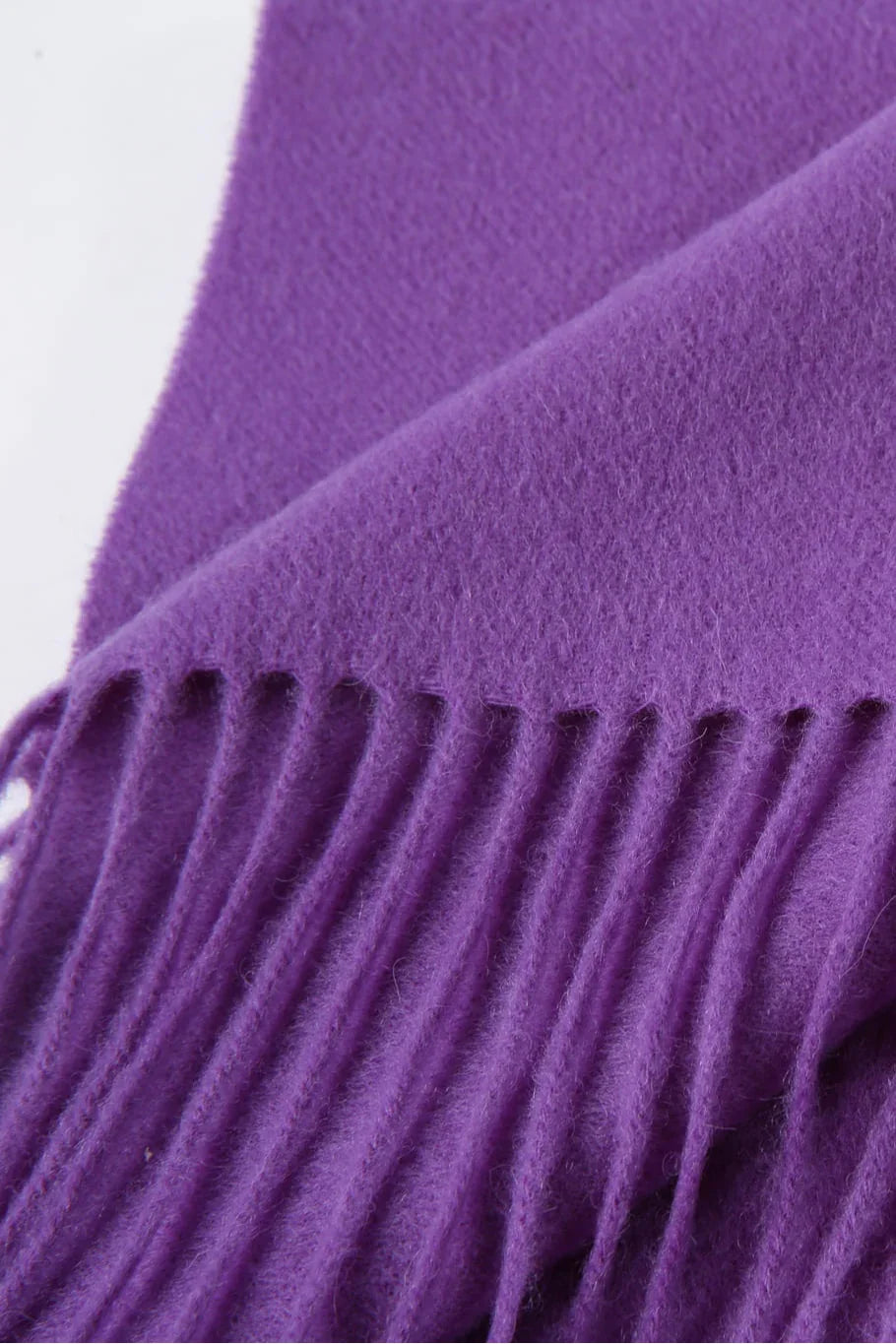 Fringe close-up of the Iris purple scarf