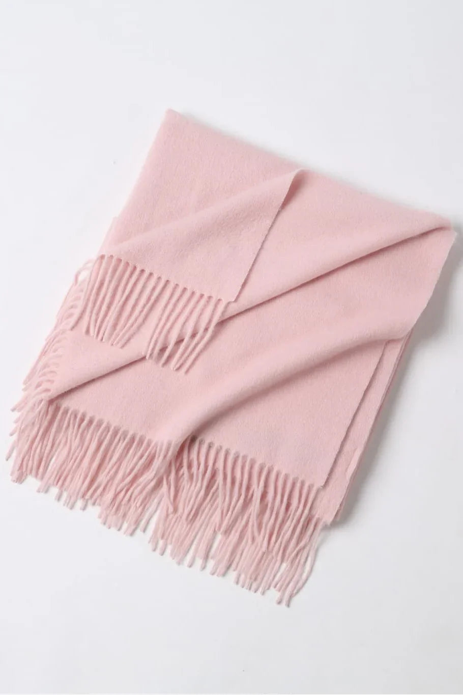 Dahlia pink scarf folded flat with fringe