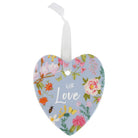 Blue ceramic heart printed with spring florals and With Love script, hung on a white ribbon
