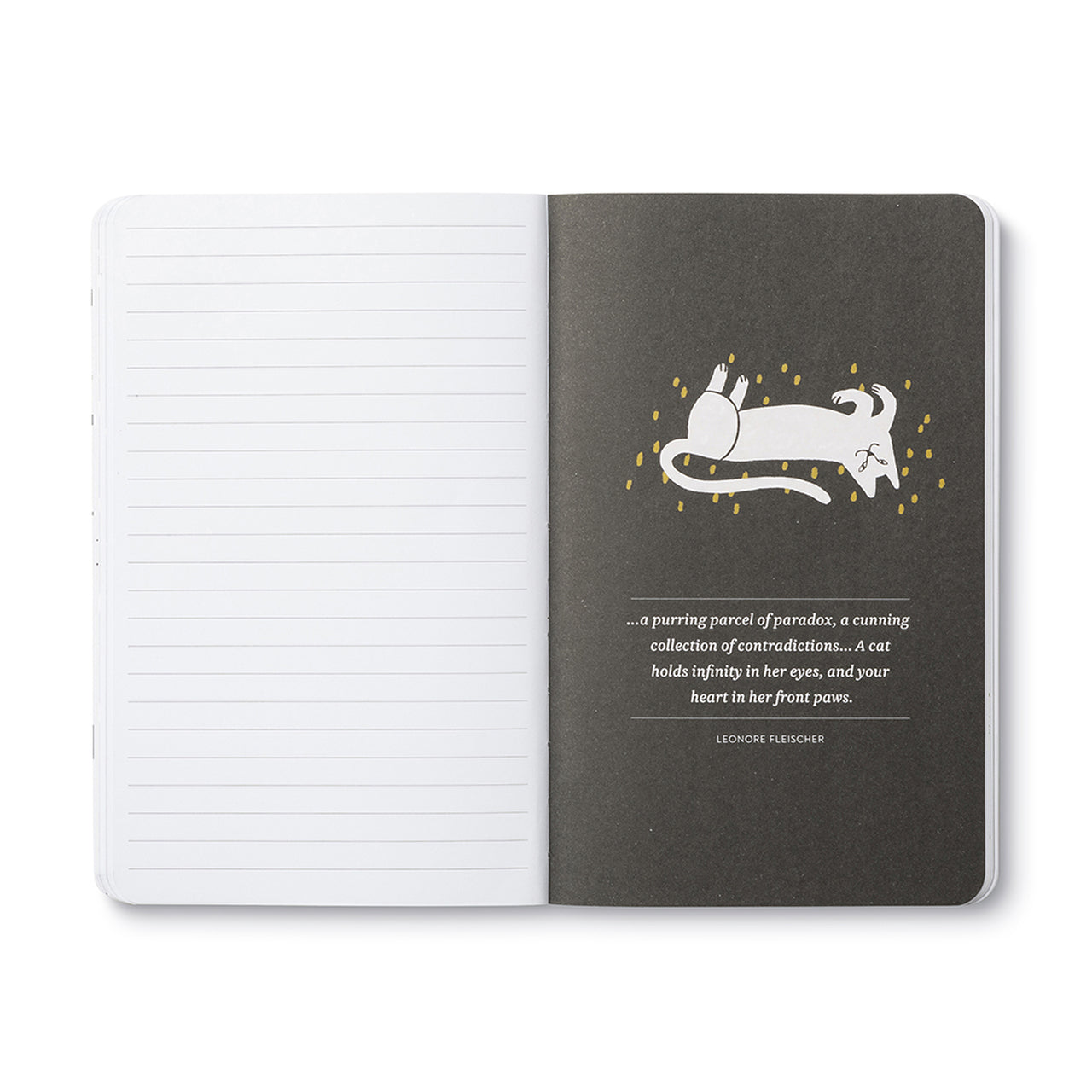 Open journal with lined pages beside a charcoal breakout page of a white leaping cat and a quote
