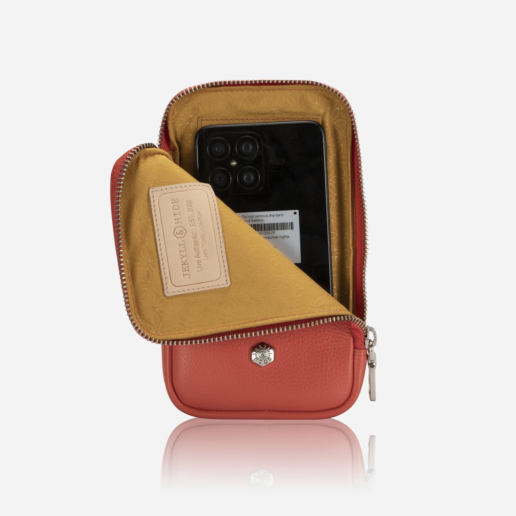 Apricot phone pouch with flap open showing phone inside and golden lining