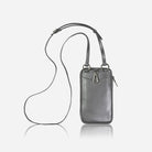 Metallic silver phone pouch hanging from its crossbody strap