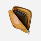 Yellow phone pouch unzipped showing card slots and tablet pocket