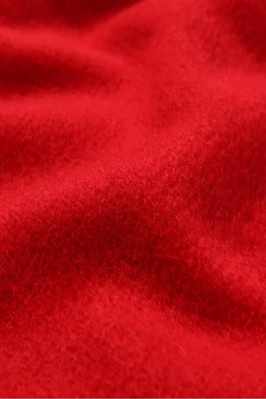 Texture close-up of the Raving Red merino weave