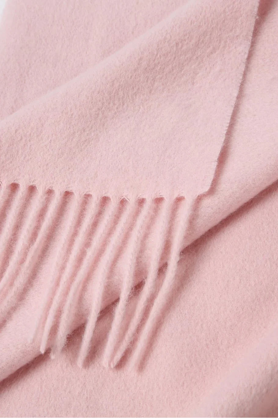Fringe close-up of the Dahlia pink merino scarf