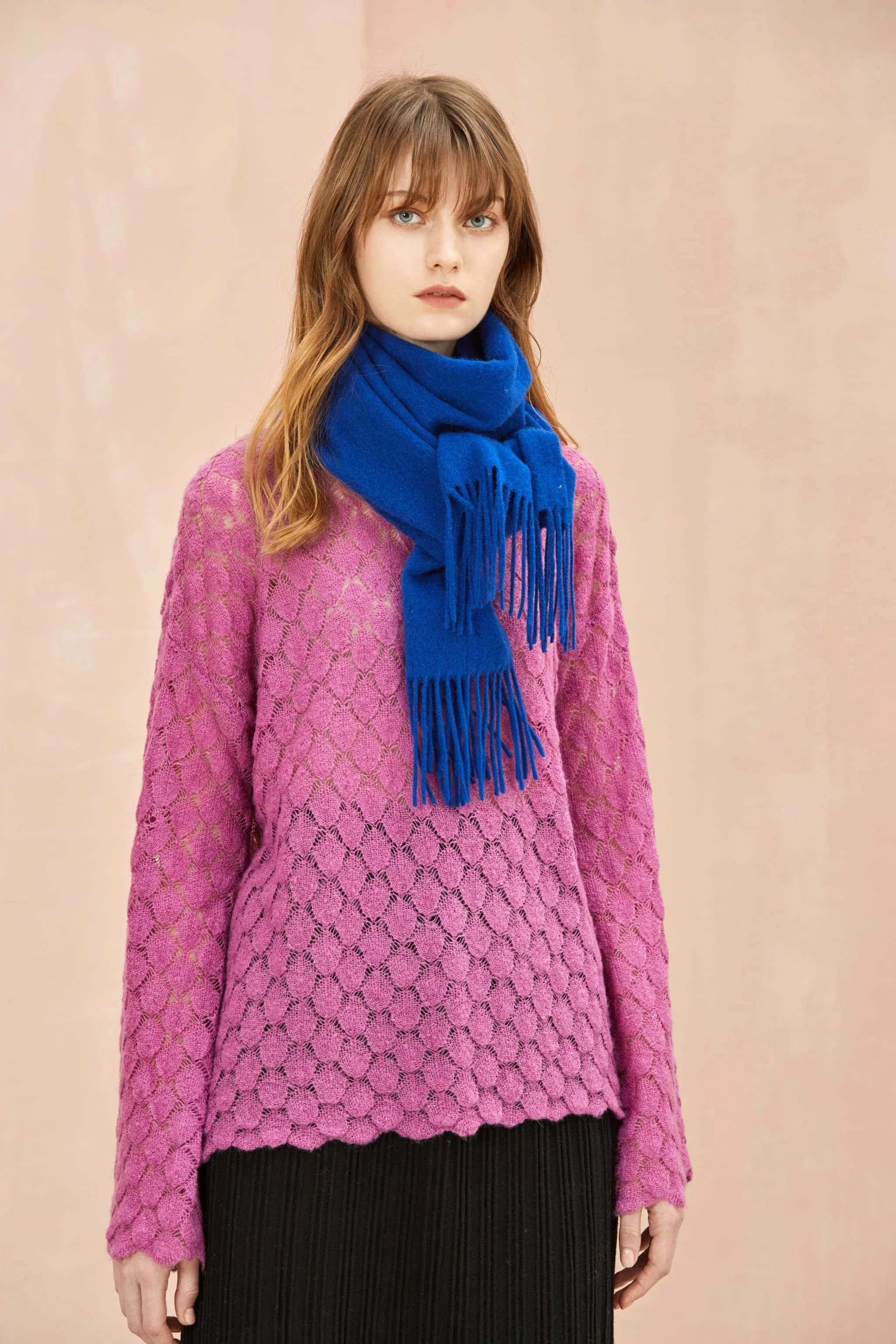 Veronica Blue cobalt scarf draped at the neck over a pink jumper