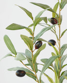 Close view of the artificial olive spray showing the leaf detail and dark olives