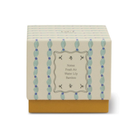 Cream and blue striped gift box printed with the fragrance notes: fresh air, water lily and bamboo.
